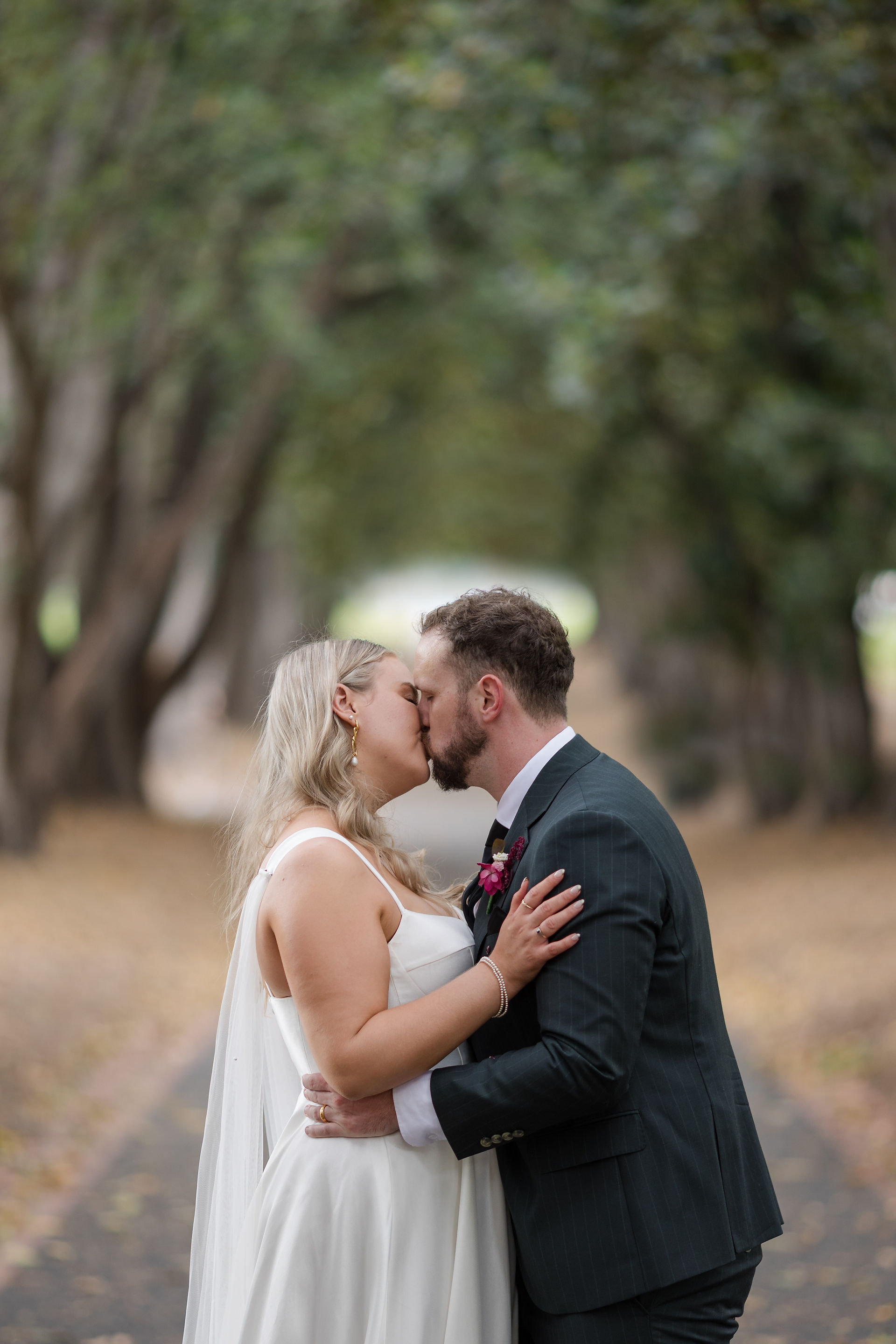 Bride and groom holding hands Treasury Gardens Melbourne wedding