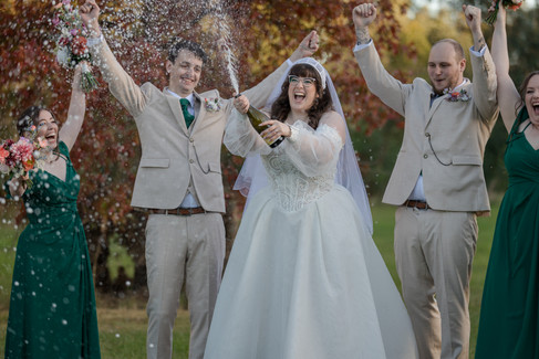 Bride spraying champagne