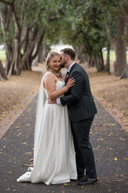 Bride and groom smiling together Treasury Gardens Melbourne portraits