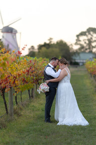 Elegant portrait of newlyweds beneath golden evening skies