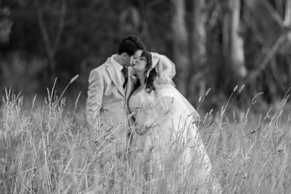 Bride and groom sharing intimate moment during sunset in Macedon Ranges