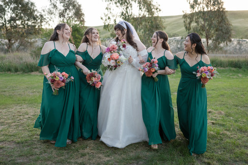 Bride laughing with her bridesmaids at DV Cider