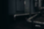 gray pipes mounted on concrete wall arrangement_edited.jpg