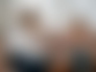 A woman as coach or counsellor talking to a young woman on a sofa