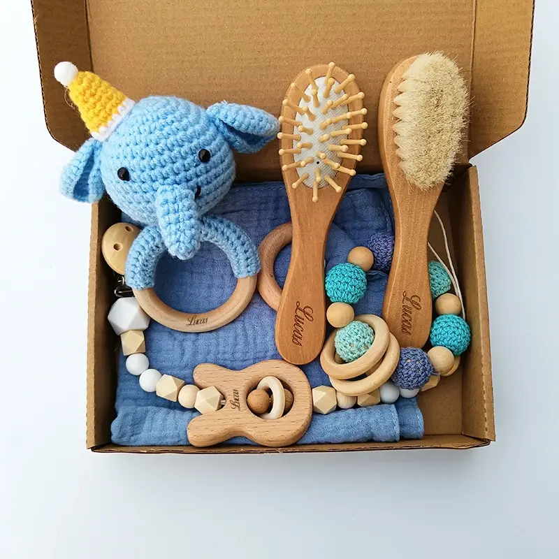 Baby gift set with crochet elephant, brushes, teethers