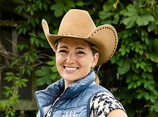 Headshot of our trainer Rikke smiling into the camera