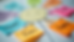 Close-up view of a colorful empathy map with sticky notes arranged in four quadrants on a wall