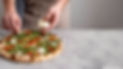 man-putting-mozzarella-baked-pizza-dough-with-smoked-salmon-slices.jpg