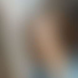 Buff cat looking at camera