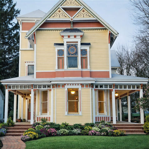 Yellow Victorian house with porch and stained glass