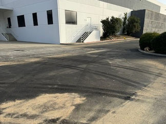 The image depicts a sprawling white warehouse equipped with trucking bays, illustrating the operational hub of Pacific Commercial Property Services. Within this scene, trucks are actively engaged in loading and unloading goods at the logistics facility, showcasing the dynamic nature of commercial activities. This snapshot encapsulates the company's specialization in cleaning, maintaining, and enhancing commercial properties across Temecula, Temecula Valley, and surrounding cities like Murrieta, Wildomar, Corona, and Riverside. With a focus on comprehensive property solutions, Pacific Commercial Property Services ensures that each aspect of the property contributes to its functionality and visual appeal, fostering an environment conducive to success for businesses and tenants alike.