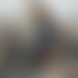 Professional pondering at bright city office window