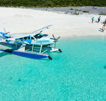 A seaplane parked at a beach in the Exumas, Bahamas