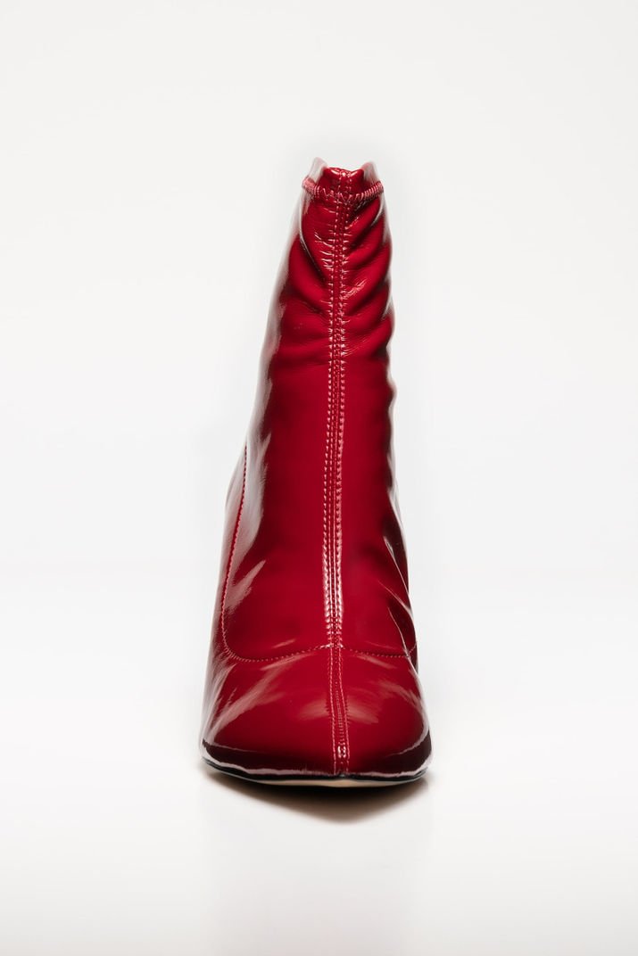 Designer leather boots e-commerce product photo with white background and shadow detail