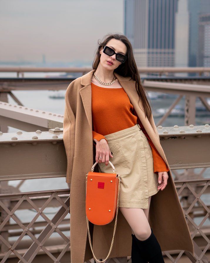 Professional fashion model photography in Brooklyn studio with dramatic lighting and pose