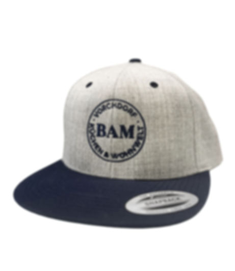 Hellgraue Cape mit blauen rundem Logo BAM.wohnen