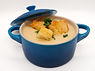 A mini cocotte filled with cream of garlic topped by croutons