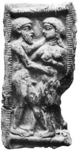 Ancient stone relief of a man and woman in an intimate embrace. Weathered texture with intricate details in a rectangular frame.