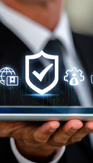 a business man holding an ipad with digital icons representing trade, investment, money , time