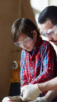 A father teaching his son about wood work