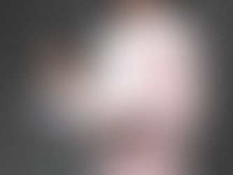 A female teacher with book and chalk in her hands