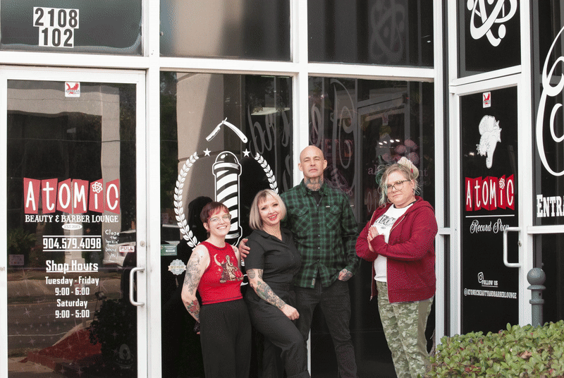 Employees outside of shop
