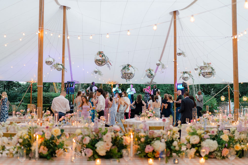 Disco balls over dancefloor in sailcloth wedding tent