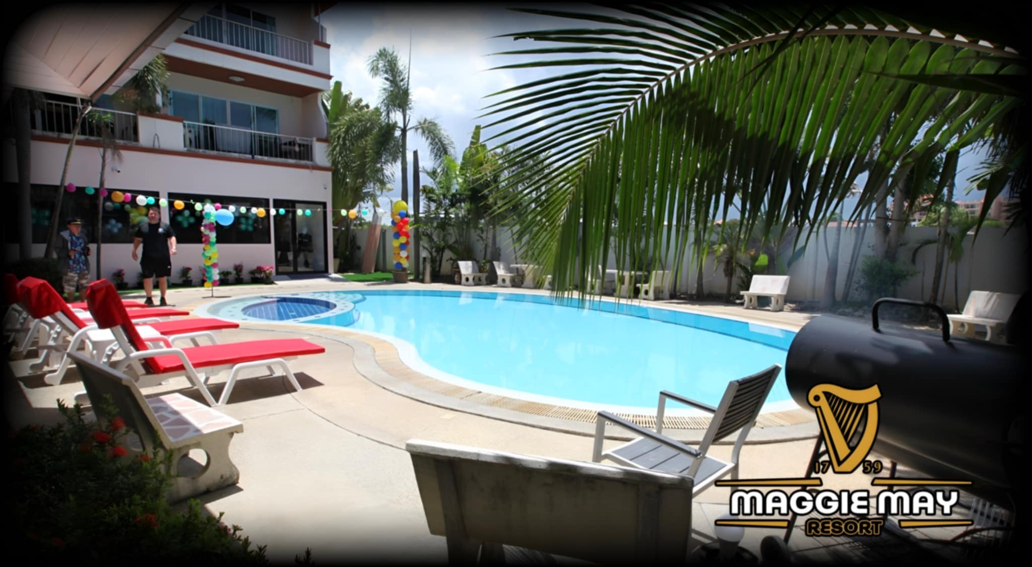 Maggie Mays Resort pool courtyard and sun loungers; photograph date unknown.