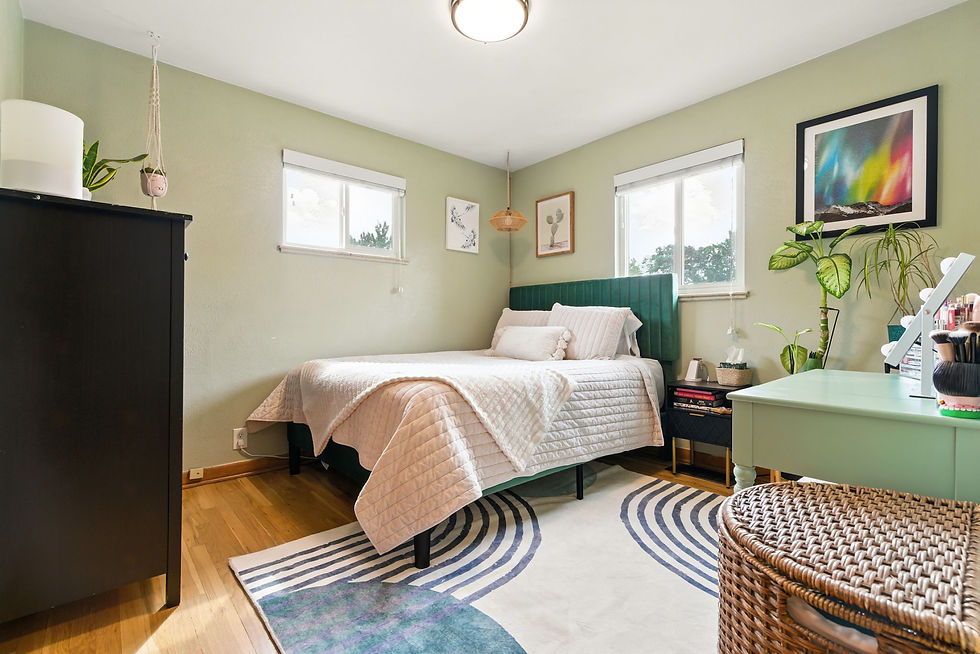 Bedroom 1 with bright windows and natural light