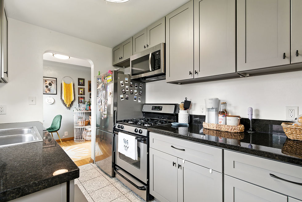 Remodeled kitchen with stainless steel appliances, granite counter tops, and gas stove