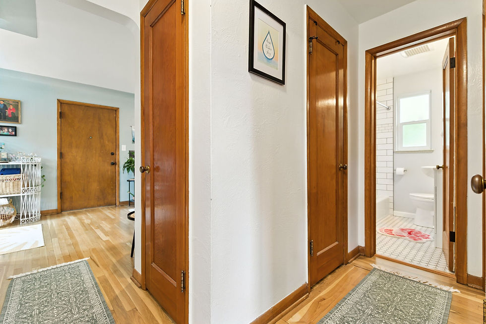 Main hallway with three storage closets