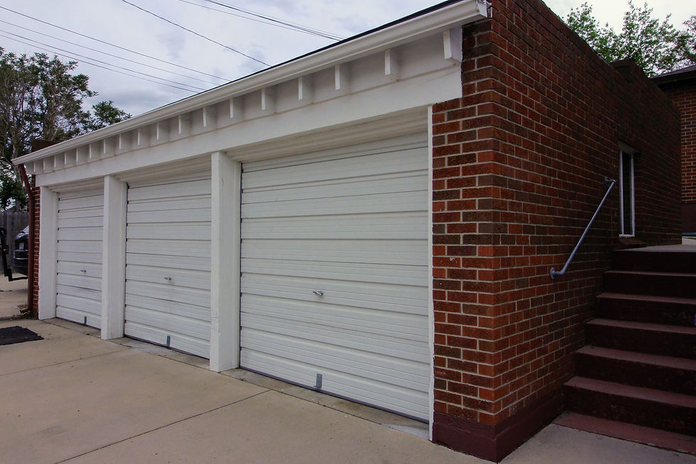 Single-car garage space with stairs to 4470 Federal