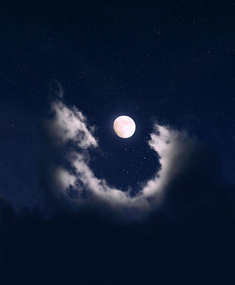 Moon in a starry sky with clouds surrounding it