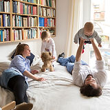 Family engaging in play activities at home supporting child development and sensory integration