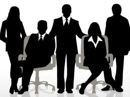 Silhouettes of business professionals standing together, symbolizing teamwork and the employee life cycle