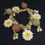 Miniaturbild: "The ephemeral beauty of life" is a charm bracelet with white daisies and balls. Juliette K