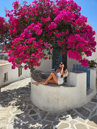 girl sitting under bouganvillea