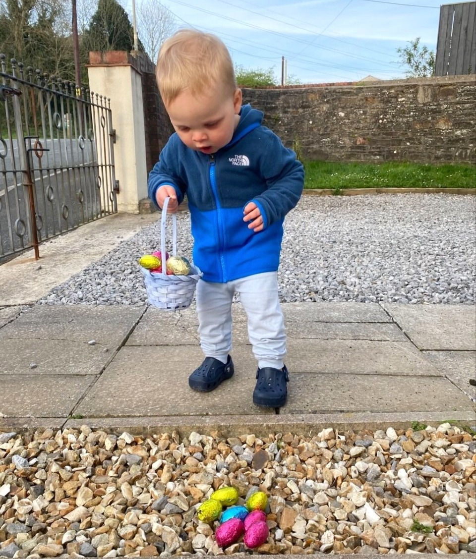 A child doing an Easter egg hunt in the garden