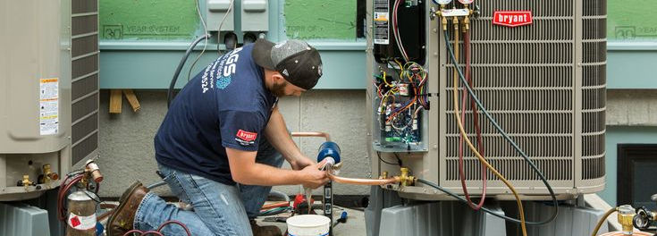 man repairing hvac
