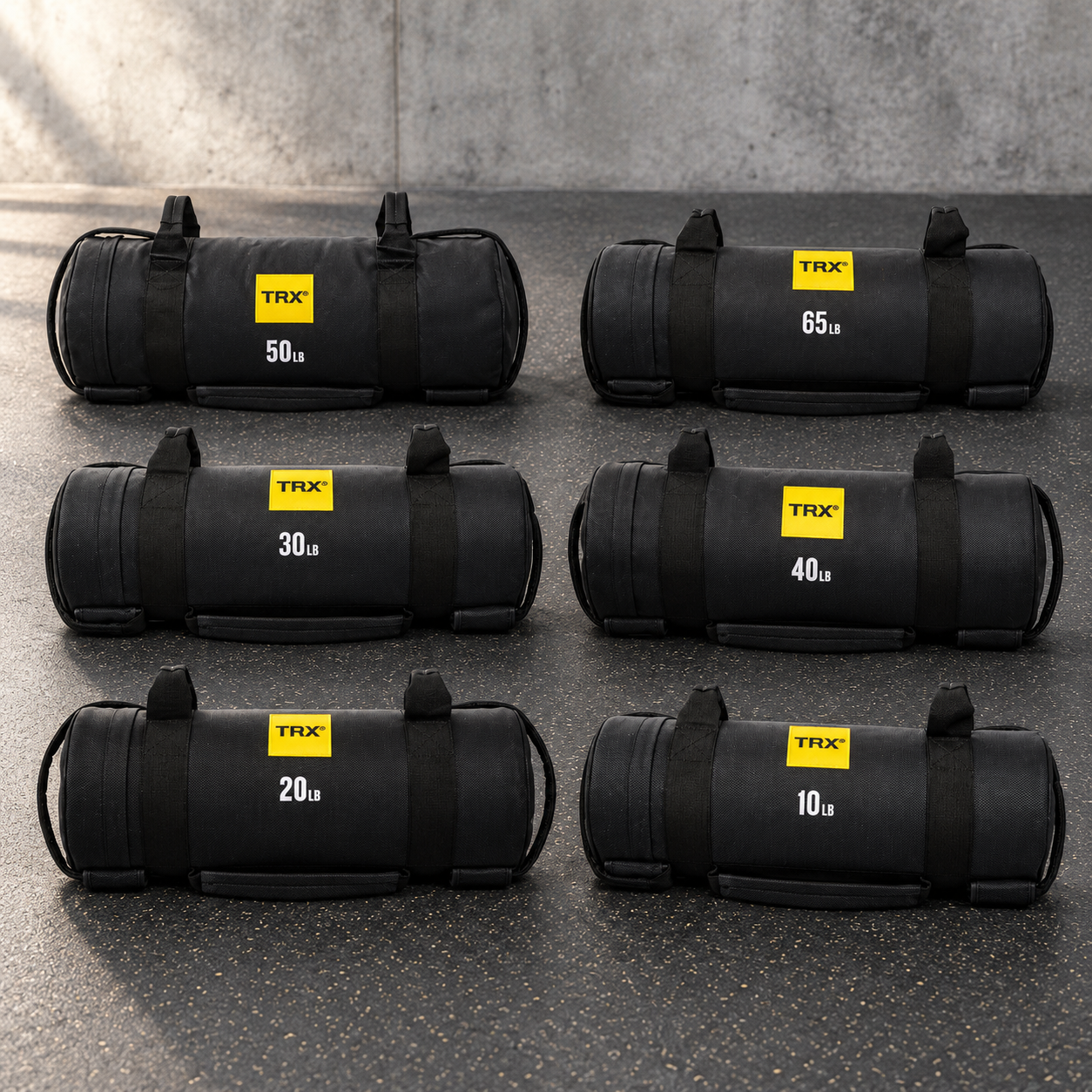 Six TRX HexGrip Power Bags in various weights from 10 to 60 lbs.