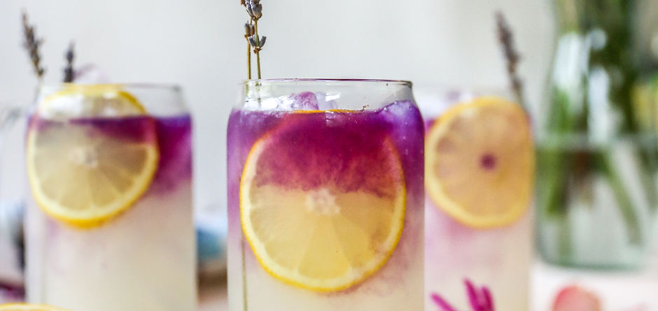 multicolored cocktail garnished with fruit