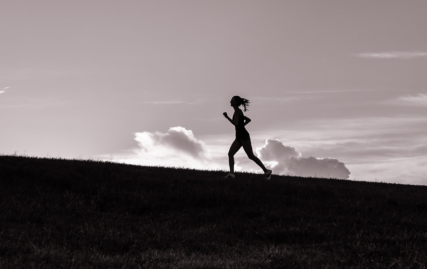 Bec silhouetted whilst running