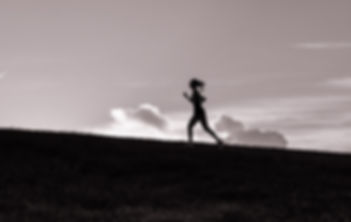 Bec silhouetted whilst running