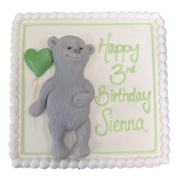 Adorable grey bear cake featuring a balloon, perfect for any celebration or special occasion. Ideal for animal lovers and children's parties.