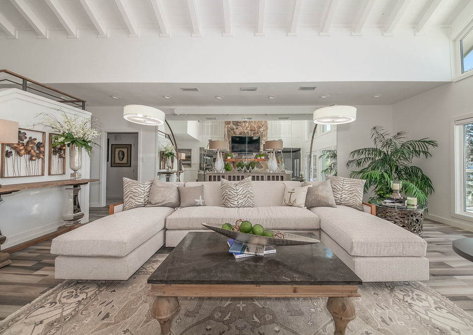 Inviting kitchen space designed by an interior designer in Orange Beach, AL. The room boasts a perfect balance of functionality and style, with contemporary appliances and beautiful accents.