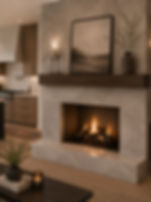 Modern stone fireplace with a wooden mantel and lit fire