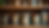 Eye-level view of a wooden shelf with assorted tea tins
