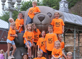 New Creations Kids posing with Giant Teddy Bear