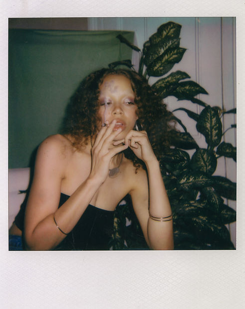 Polaroid of Pixie Smoking Pixie Pre-rolls