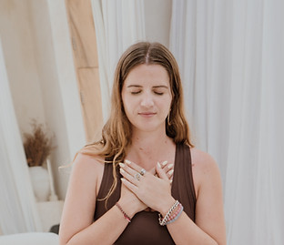 Reiki student with hands on heart